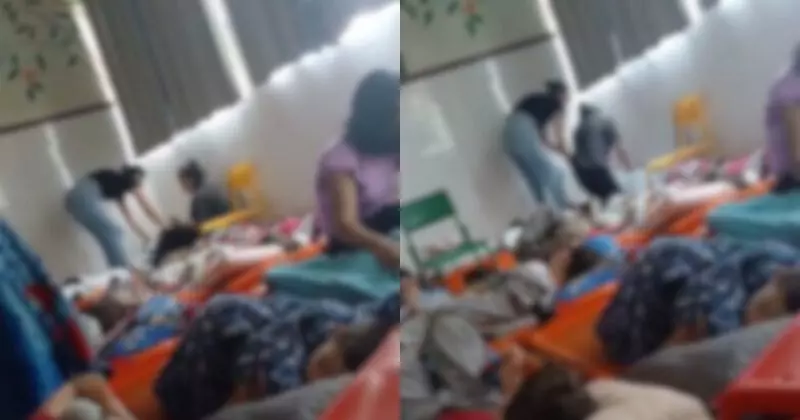 Imagem borrada do momento em que a funcionária é filmada agredindo a criança em escola de Criciúma